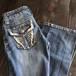 Boot cut jeans with angel wing design on pocket